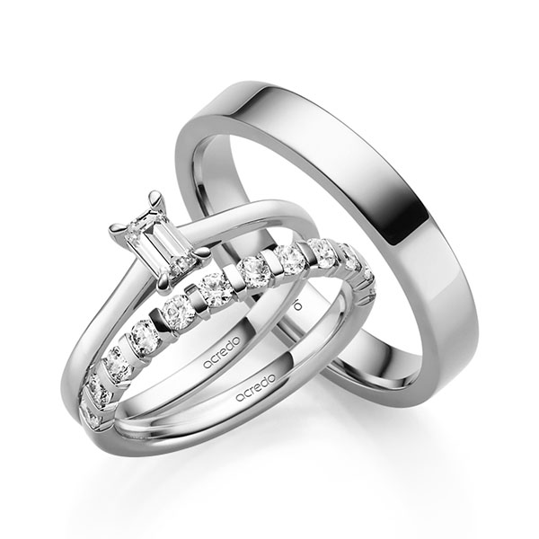 Triset in witgoud 14 kt. met 0,4 ct. + in totaal 0,6 ct. Briljant tw,vs van acredo