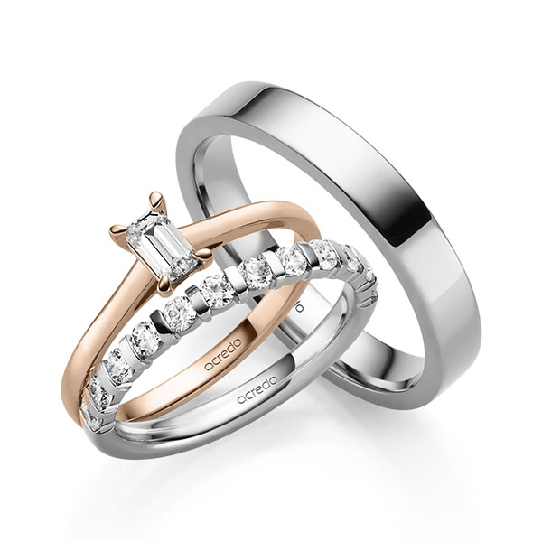 Triset in witgoud 14 kt. met 0,4 ct. + in totaal 0,6 ct. Briljant tw,vs van acredo